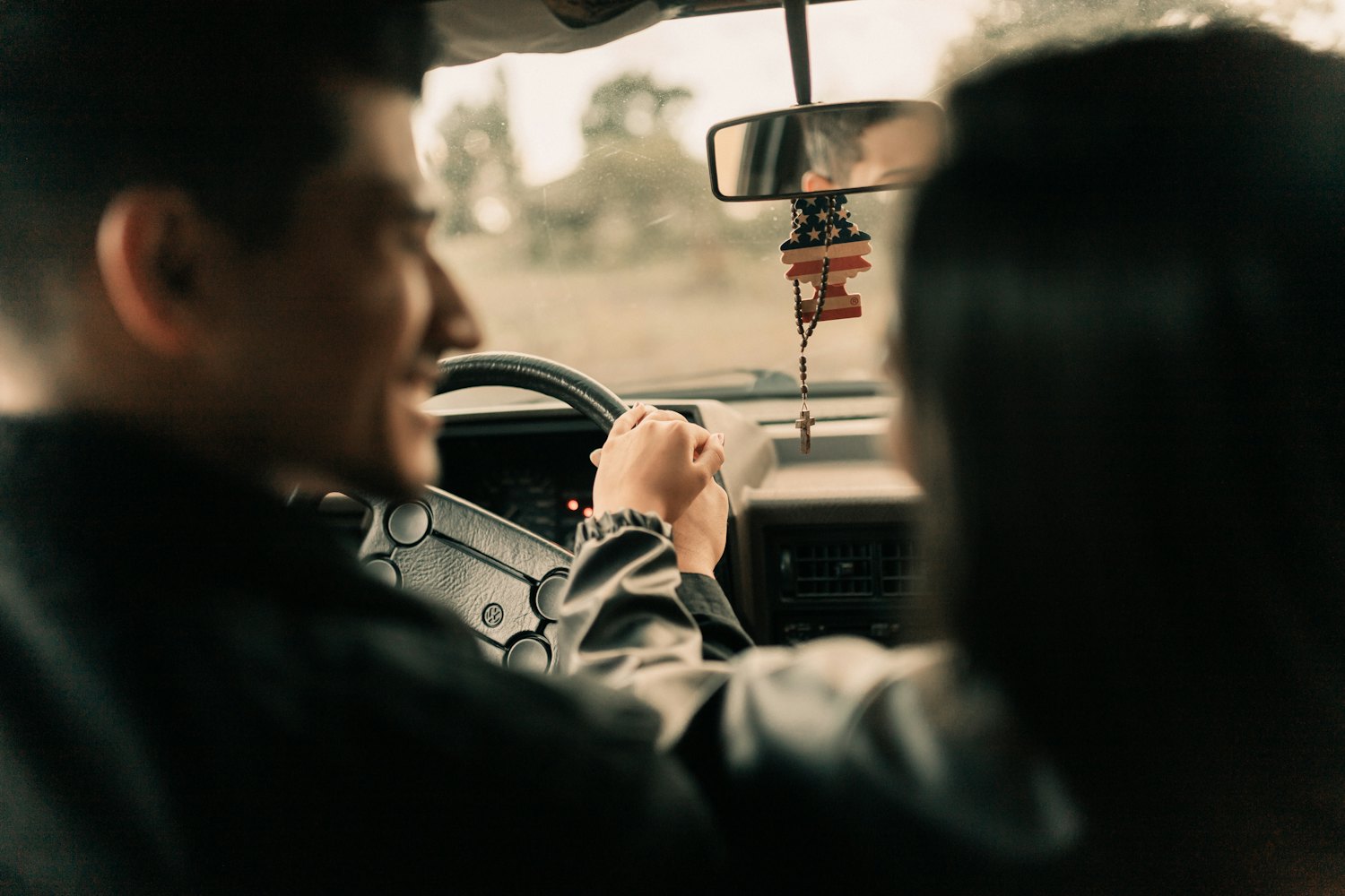A couple driving together